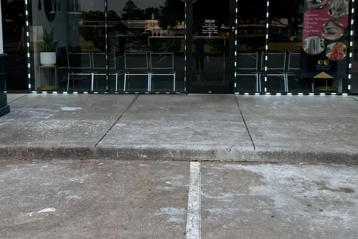 Storefront concrete before cleaning — Houston TX